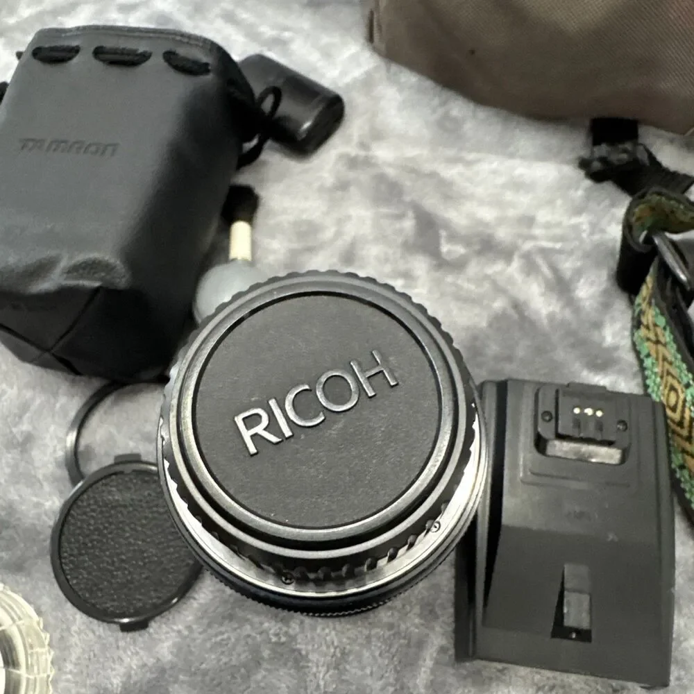 Ricoh KR-5 Film camera with lenses, flash, lens case, and camera bag.tested